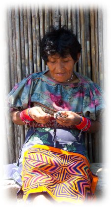 Kuna woman sewing a mola
